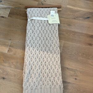 Oversized comfy throw by Nicole Miller. Brand new with tags. Beige